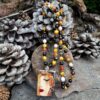 Sautoir Obsidienne dorée, Oeil de tigre miel, Grenat, Opale rose, Agate orange avec pendentif en émail