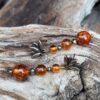 Boucles d'oreilles en Ambre, Pyrite et fleur de Lotus