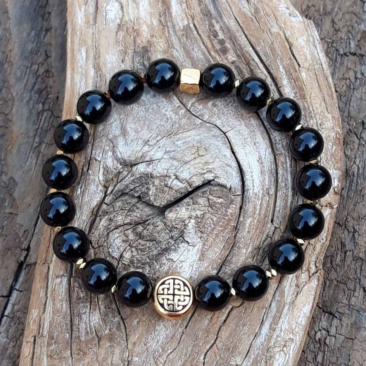 bracelet obsidienne noire de 8 mm et perle celtique dorée